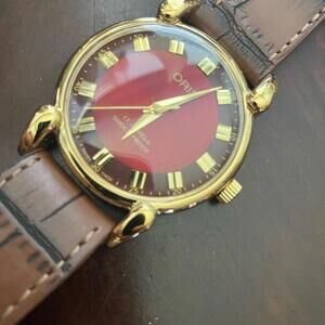 Oris Red Dial Watch with Gold Accents